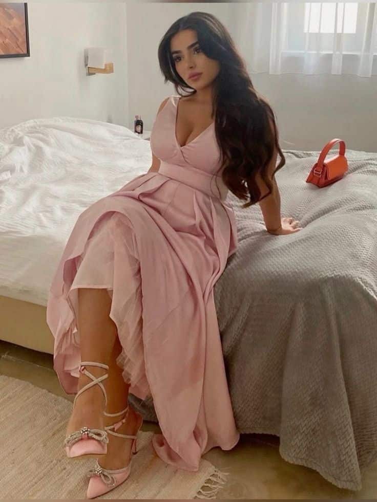 Fitness-enthusiast escort with athletic body posing before night stay