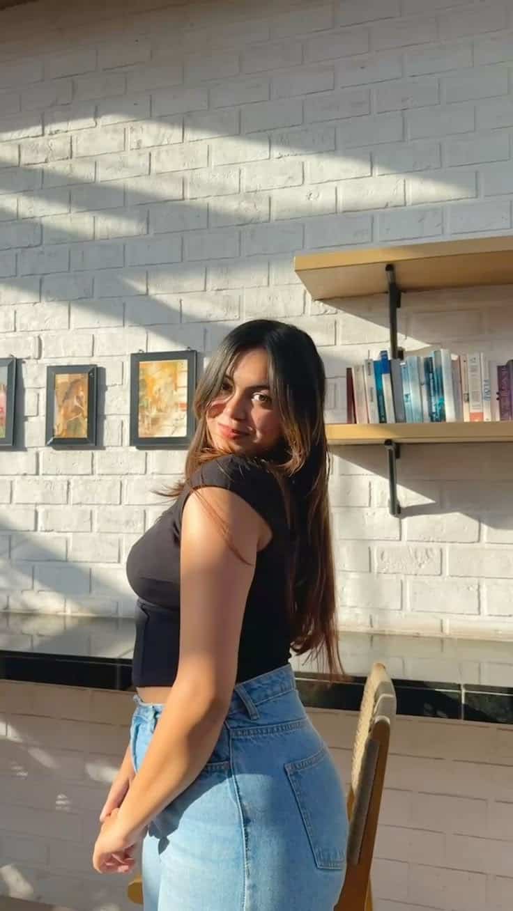 Girl-next-door escort relaxing on bed for friendly casual night booking